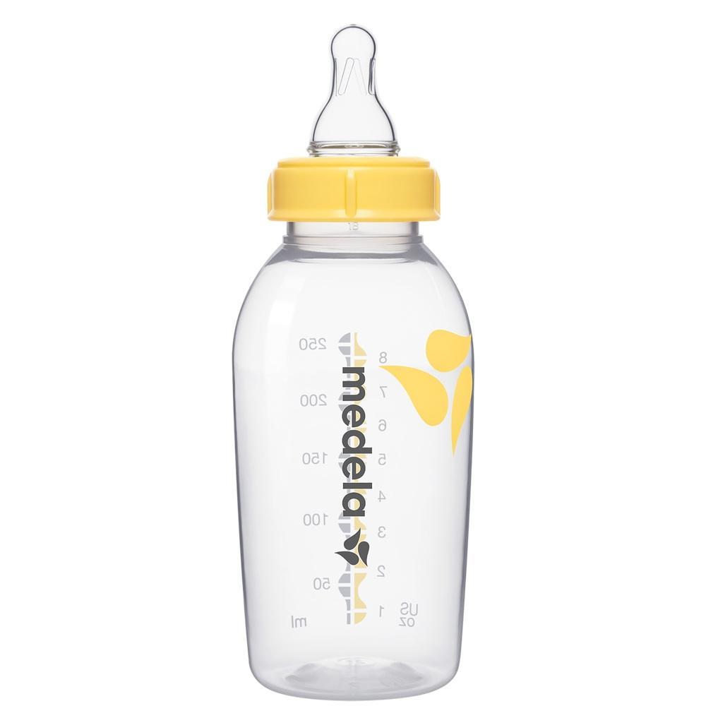 Durchsichtige Babyflasche mit gelbem Deckel und Messskala.