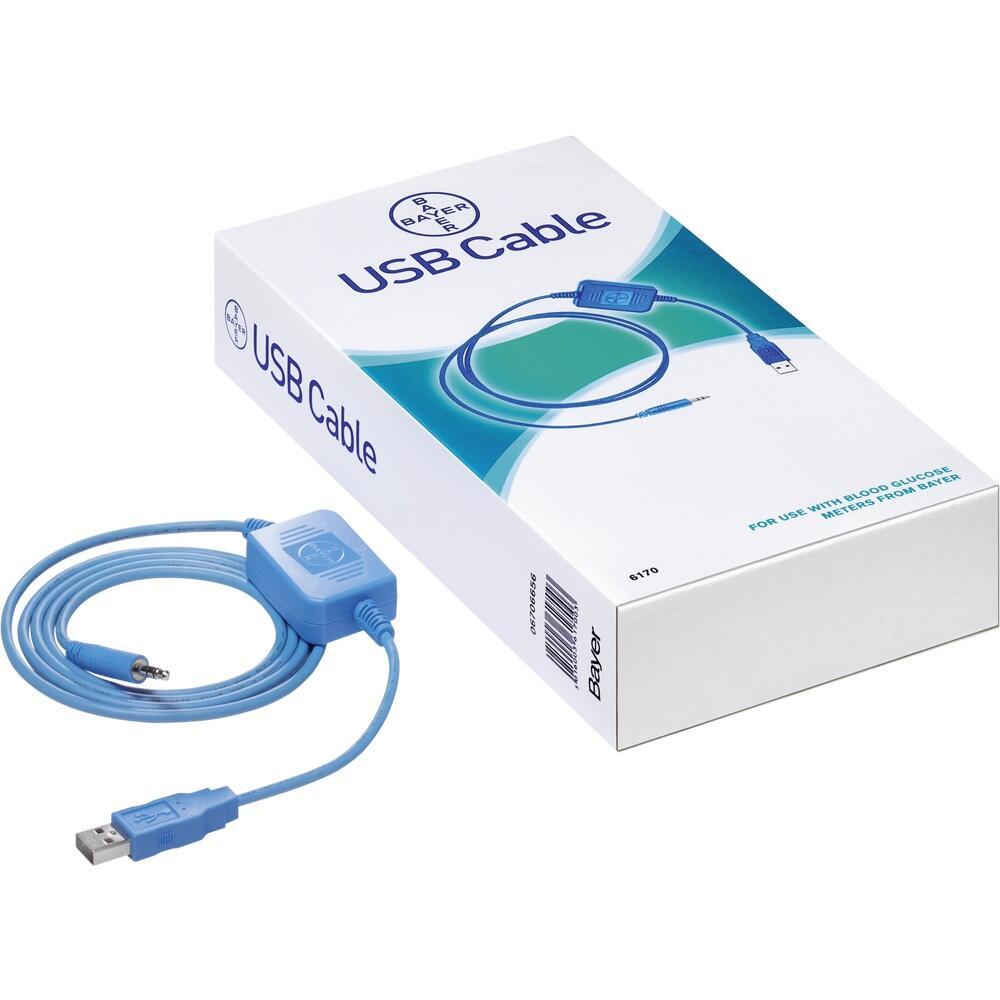 Eine Schachtel mit einem blauen USB-Kabel liegt daneben.