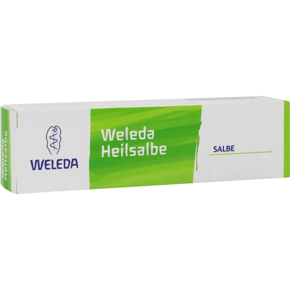 Weiße und grüne Packung von Weleda Heilsalbe mit blauem Logo.