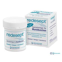 Dose und Schachtel eines Spezialreinigers für Mundduschen stehen nebeneinander.