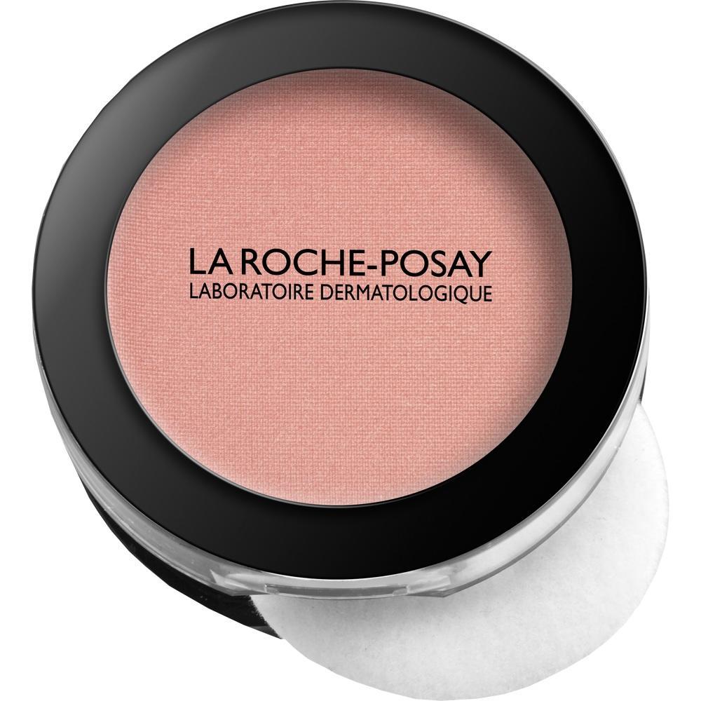Rundes Make-up in rosa mit schwarzem Rand und Schriftzug „La Roche-Posay“.