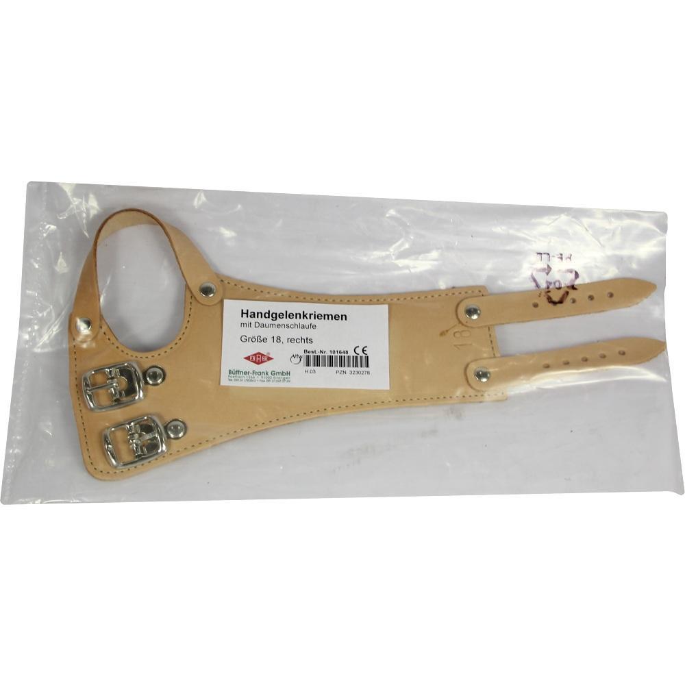 Ein beiger Handgelenkriemen aus Leder mit Schnallen in einer Verpackung.