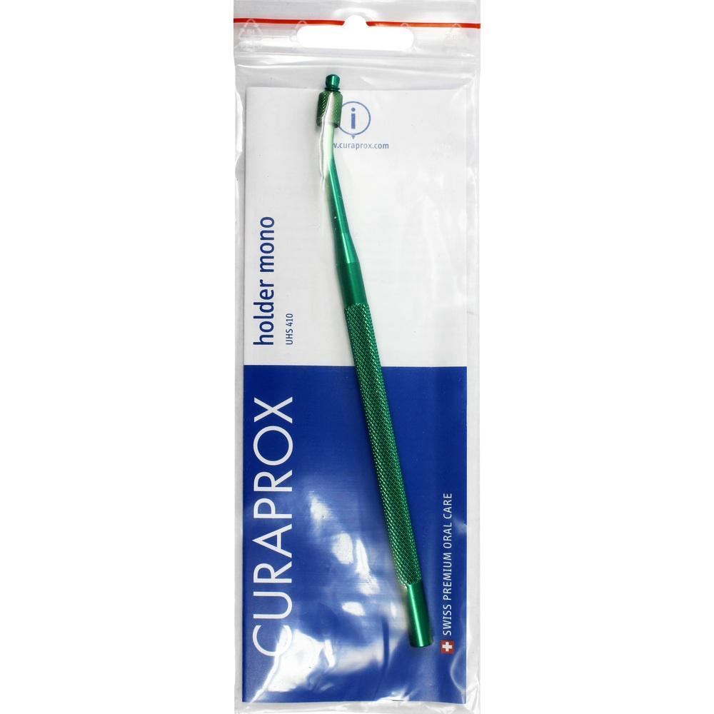 Grüner Zahnbürstenhalter in einer Verpackung aus Plastik.