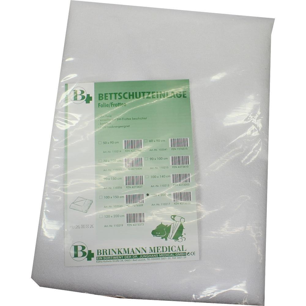 Eine verpackte Bettschutzauflage aus Folie liegt flach auf einem Tisch.