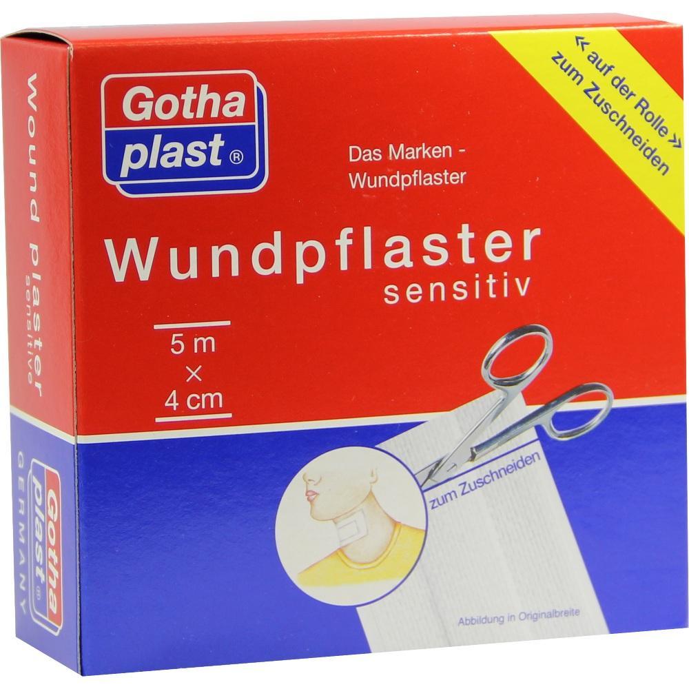 Rote Packung mit sensitivem Wundpflaster und Schere zum Zuschneiden.