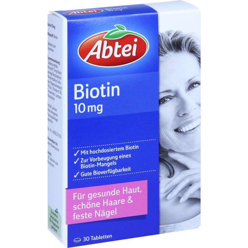 Eine Schachtel Biotin-Tabletten für Haut, Haare und Nägel, mit einer lächelnden Frau darauf.