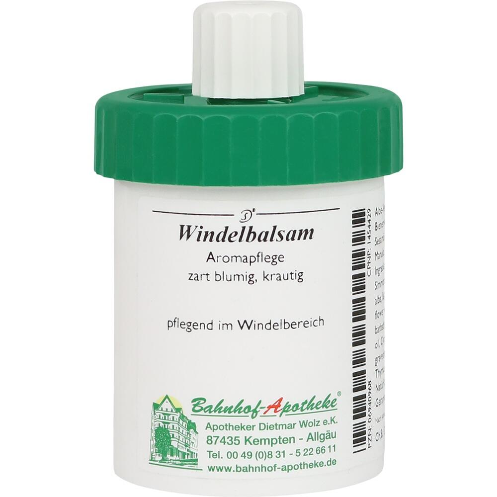 Eine wei&szlig;e Dose mit gr&uuml;nem Deckel f&uuml;r Windelbalsam.