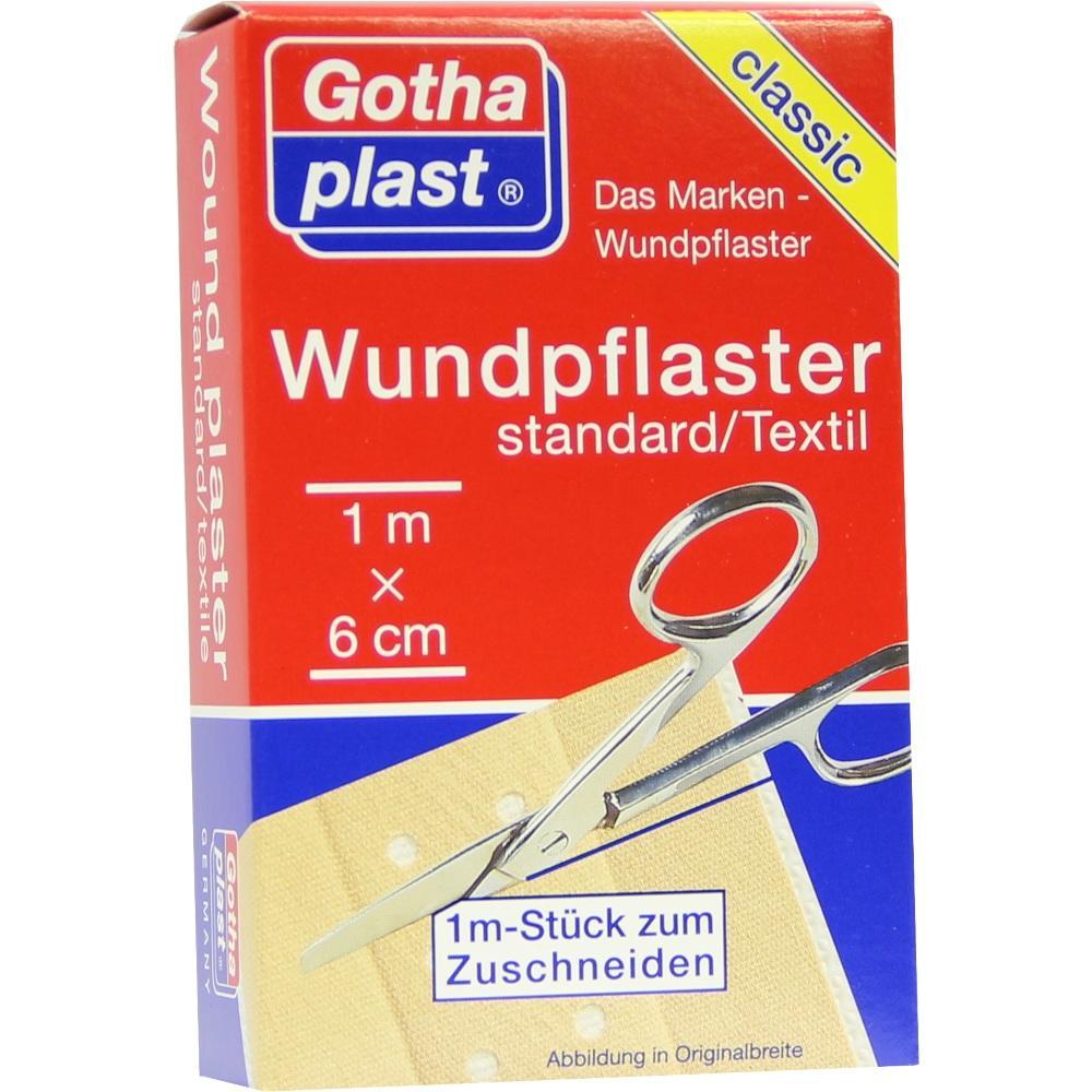Rote Packung mit Textil-Wundpflaster und Schere auf der Abbildung.