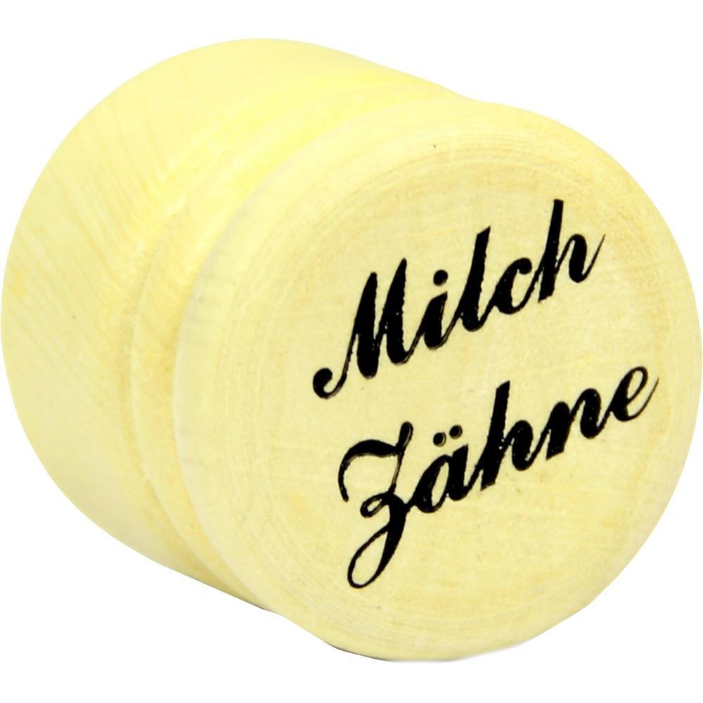 Runde, gelbe Dose mit der Aufschrift "Milchzähne".