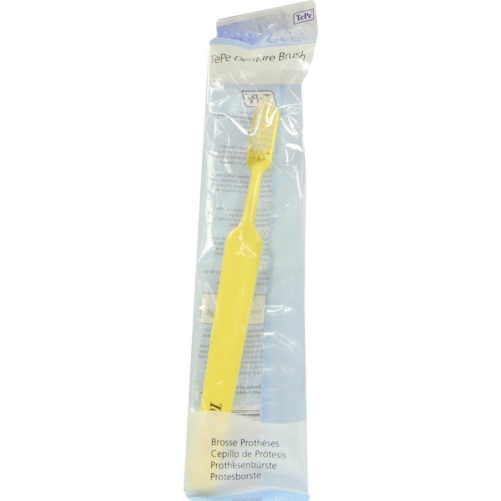 Gelbe Zahnbürste in Plastikverpackung für Prothesen.