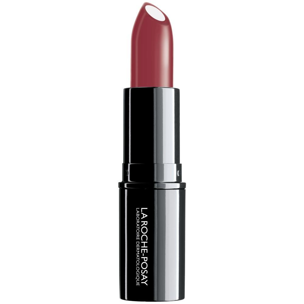 Ein roter Lippenstift mit schwarzer H&uuml;lle steht aufrecht.