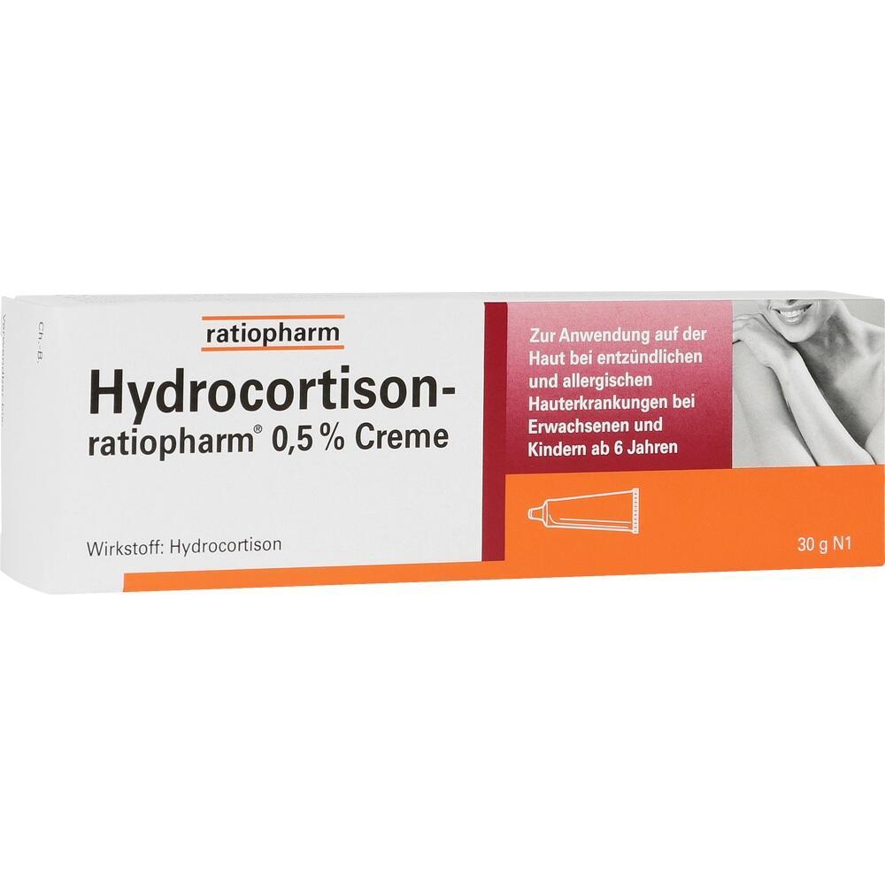 Weiße Verpackung von Hydrocortison-Creme mit orangem Bereich und Anwendungshinweisen.