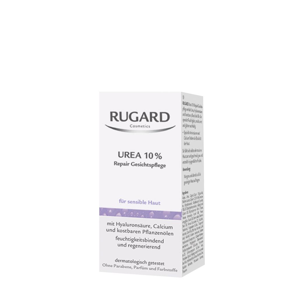 Auf dem Bild ist eine weiße Verpackung mit der Aufschrift "RUGARD Urea 10% Repair Gesichtspflege".