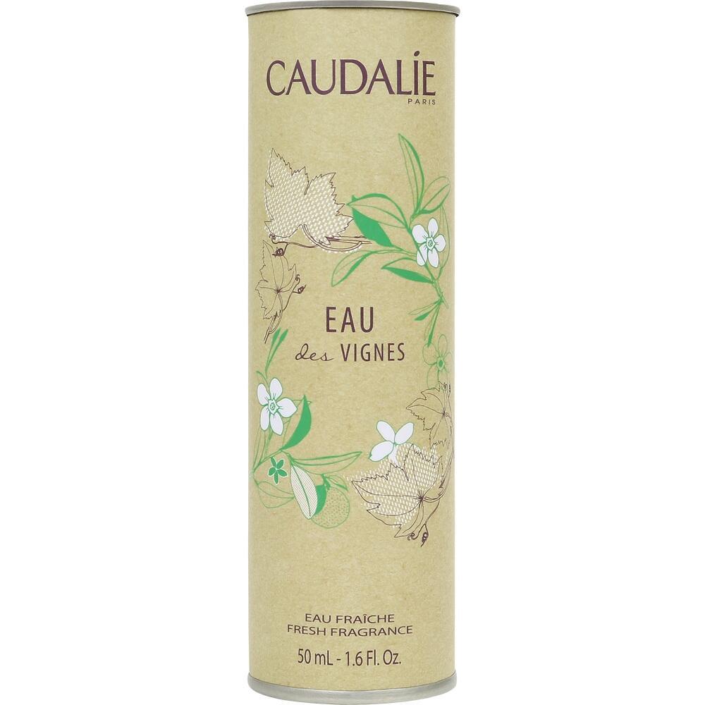 Beige Parfümverpackung mit grünem Blätter- und Blumenmuster.