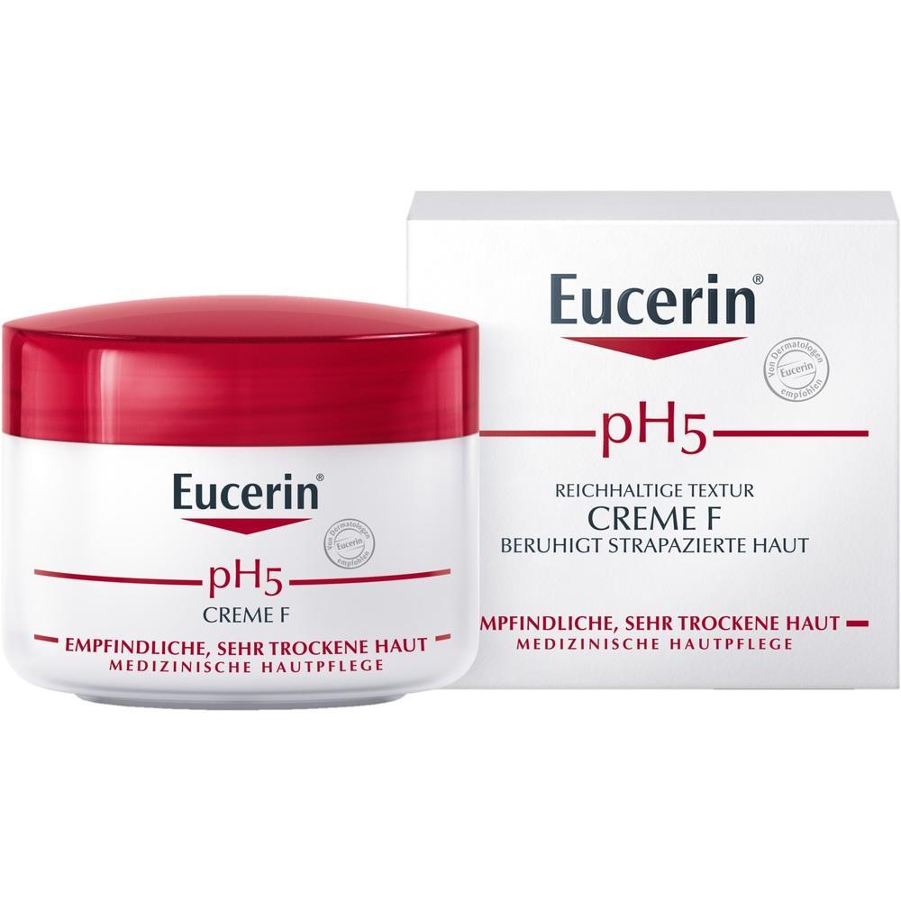 Eine wei&szlig;e Creme-Dose mit rotem Deckel steht vor ihrer Verpackung.