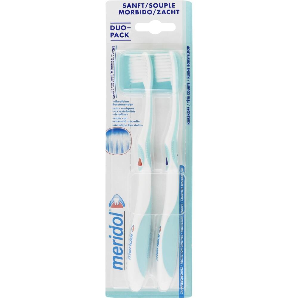 Zwei weiße Zahnbürsten in einer transparenten Verpackung von Meridol.