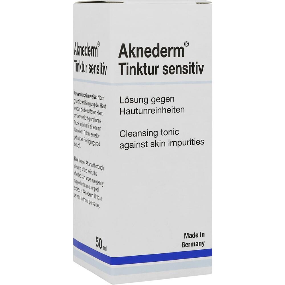 Weiße Verpackung einer Hautlösung gegen Unreinheiten mit blauer Schrift.