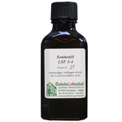 Braunes Glasfl&auml;schchen mit wei&szlig;em Etikett und schwarzem Deckel.