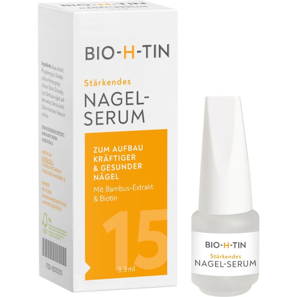 Weiße Schachtel mit Nagel-Serum und kleinem Fläschchen daneben.