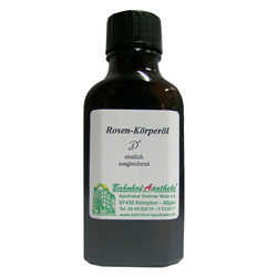 Braune Flasche mit Rosen-K&ouml;rper&ouml;l und wei&szlig;em Etikett.