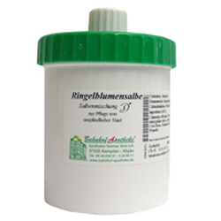 Dose mit gr&uuml;nem Deckel, beschriftet als Ringelblumensalbe.