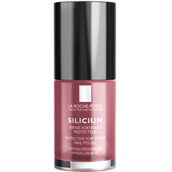 Eine rosa Flasche mit Nagellack und schwarzem Deckel.